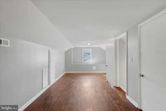 a empty room with wooden floor