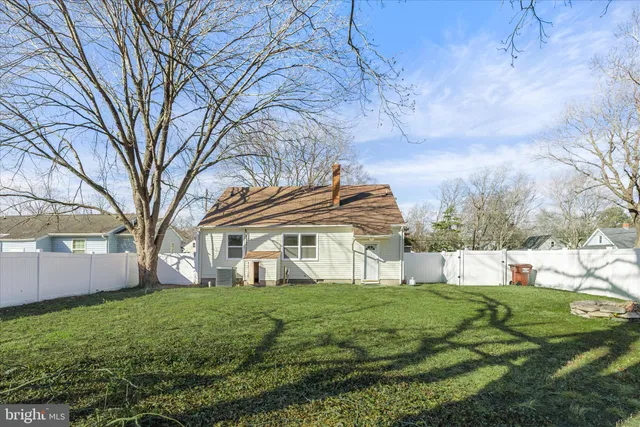a view of house with yard