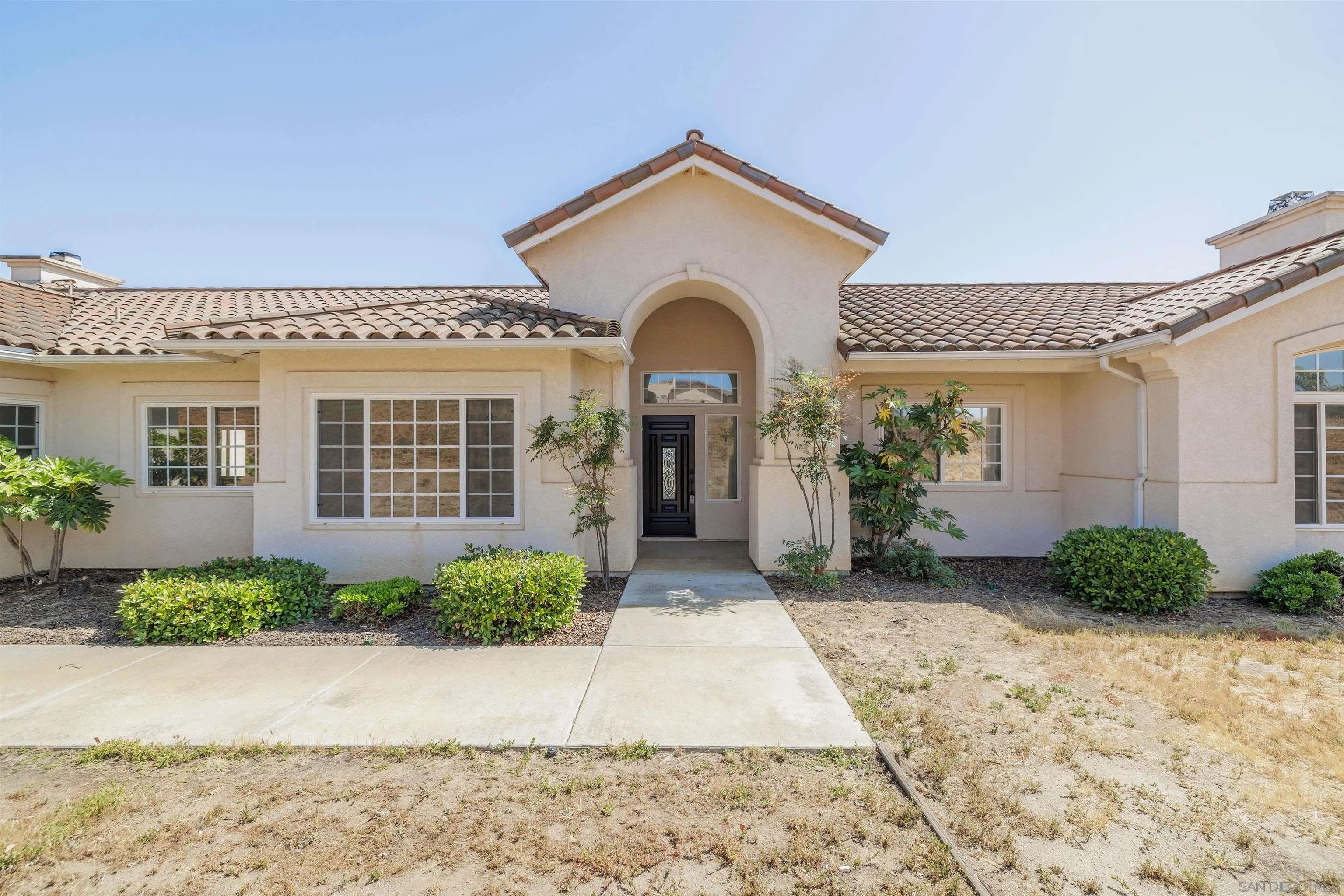 31250 Rivoli Road Valley Center, CA 92082 - Photo 1 of 57 a front view of a house with garden