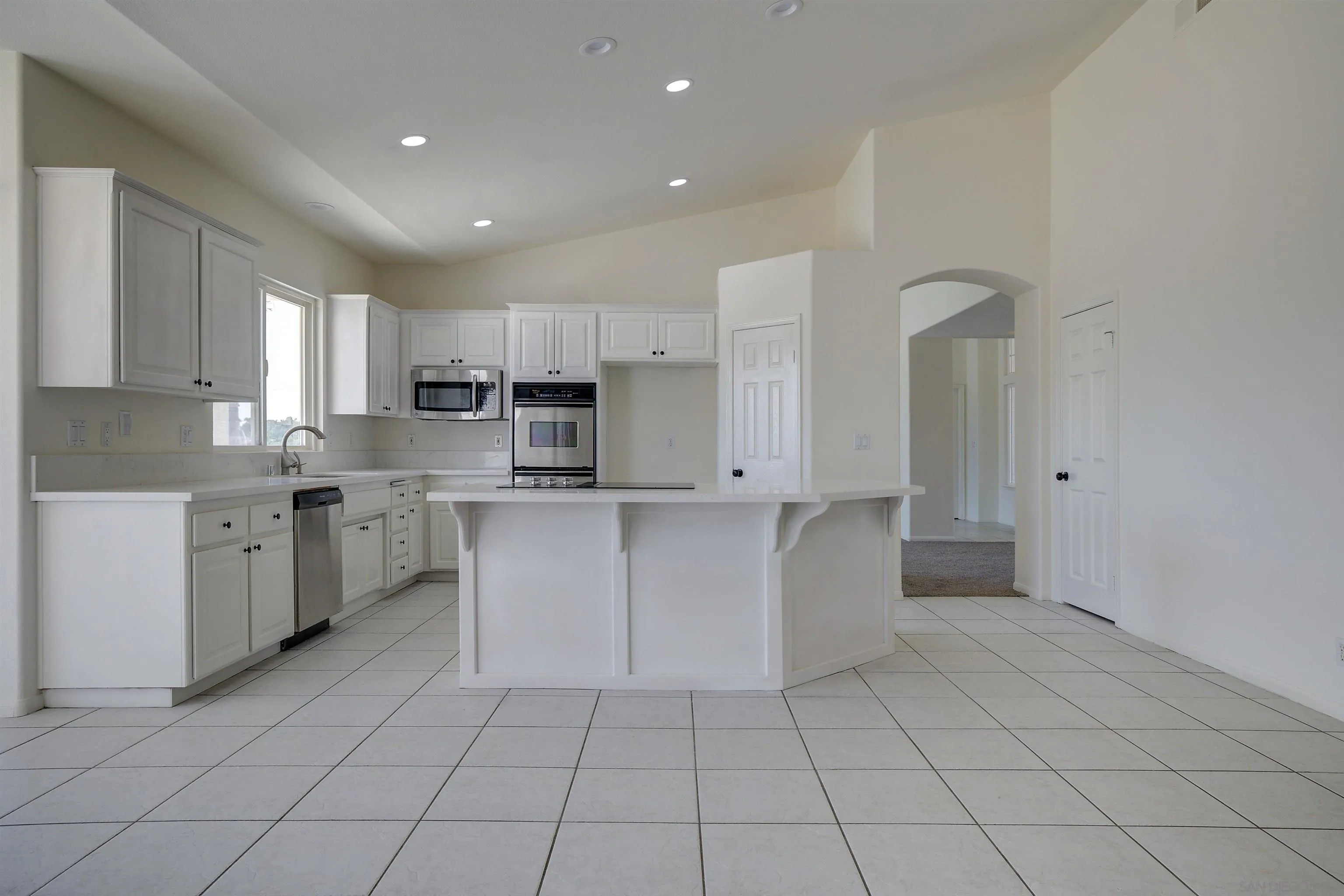 31250 Rivoli Road Valley Center, CA 92082 - Photo 17 of 57 a kitchen with cabinets and window