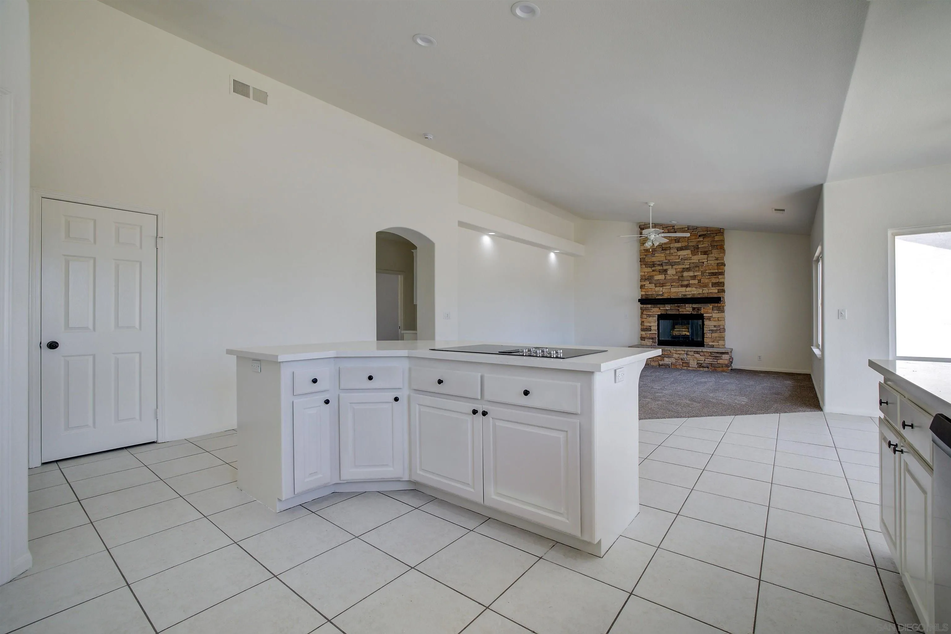 31250 Rivoli Road Valley Center, CA 92082 - Photo 21 of 57 a large white kitchen with cabinets
