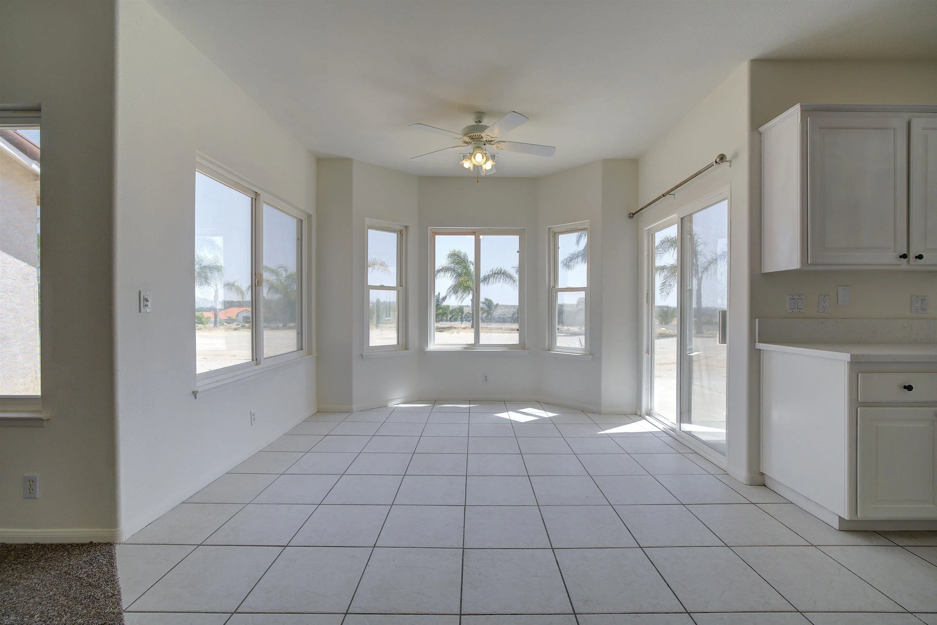 31250 Rivoli Road Valley Center, CA 92082 - Photo 22 of 57 a view of an empty room with glass door