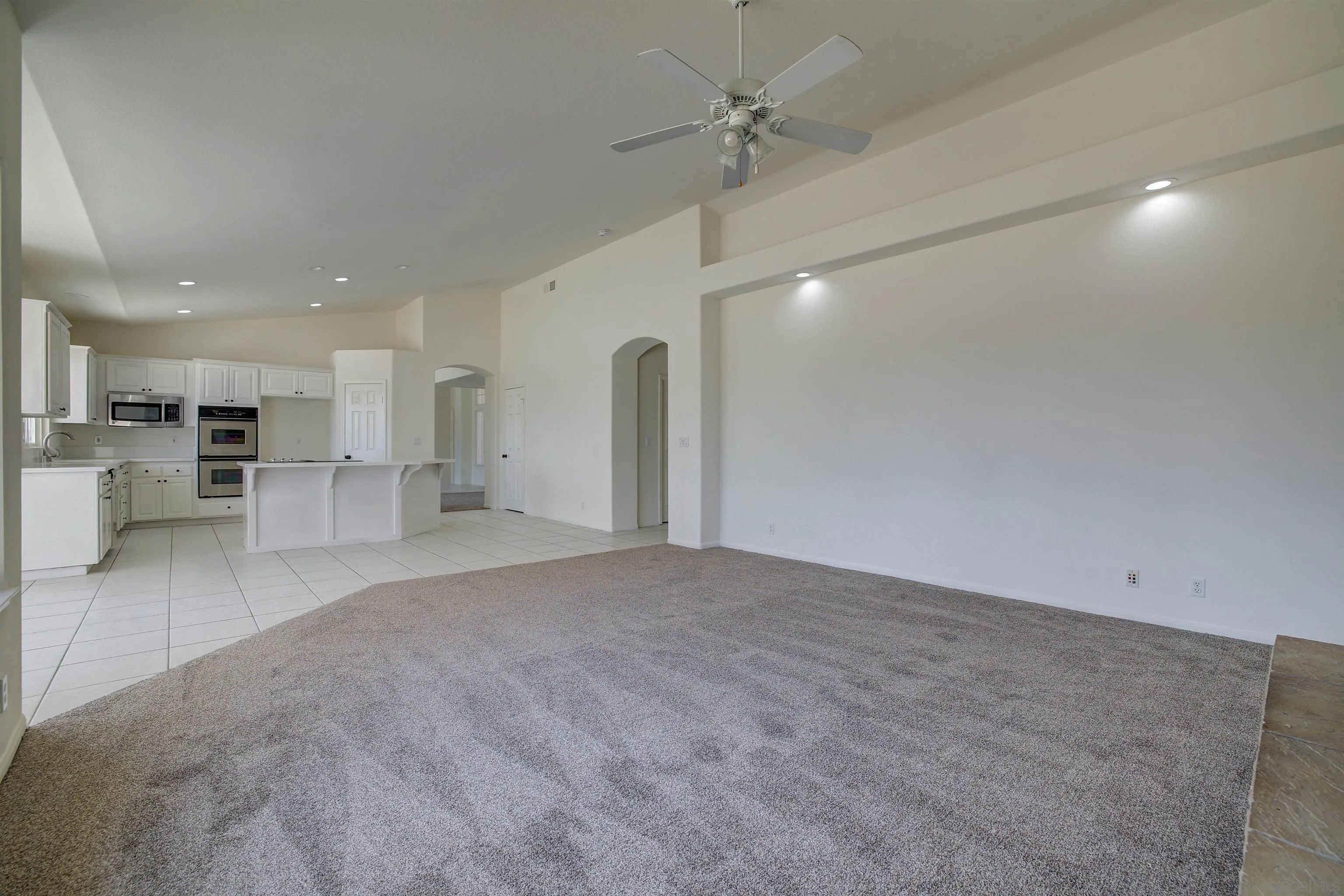 31250 Rivoli Road Valley Center, CA 92082 - Photo 24 of 57 a view of a kitchen with a refrigerator and a sink