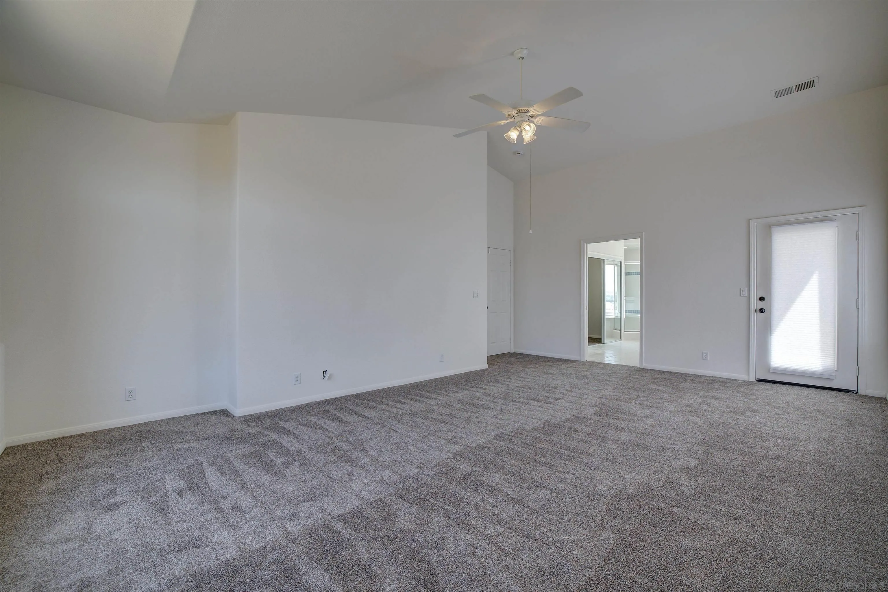 31250 Rivoli Road Valley Center, CA 92082 - Photo 30 of 57 a view of an empty room with a chandelier fan