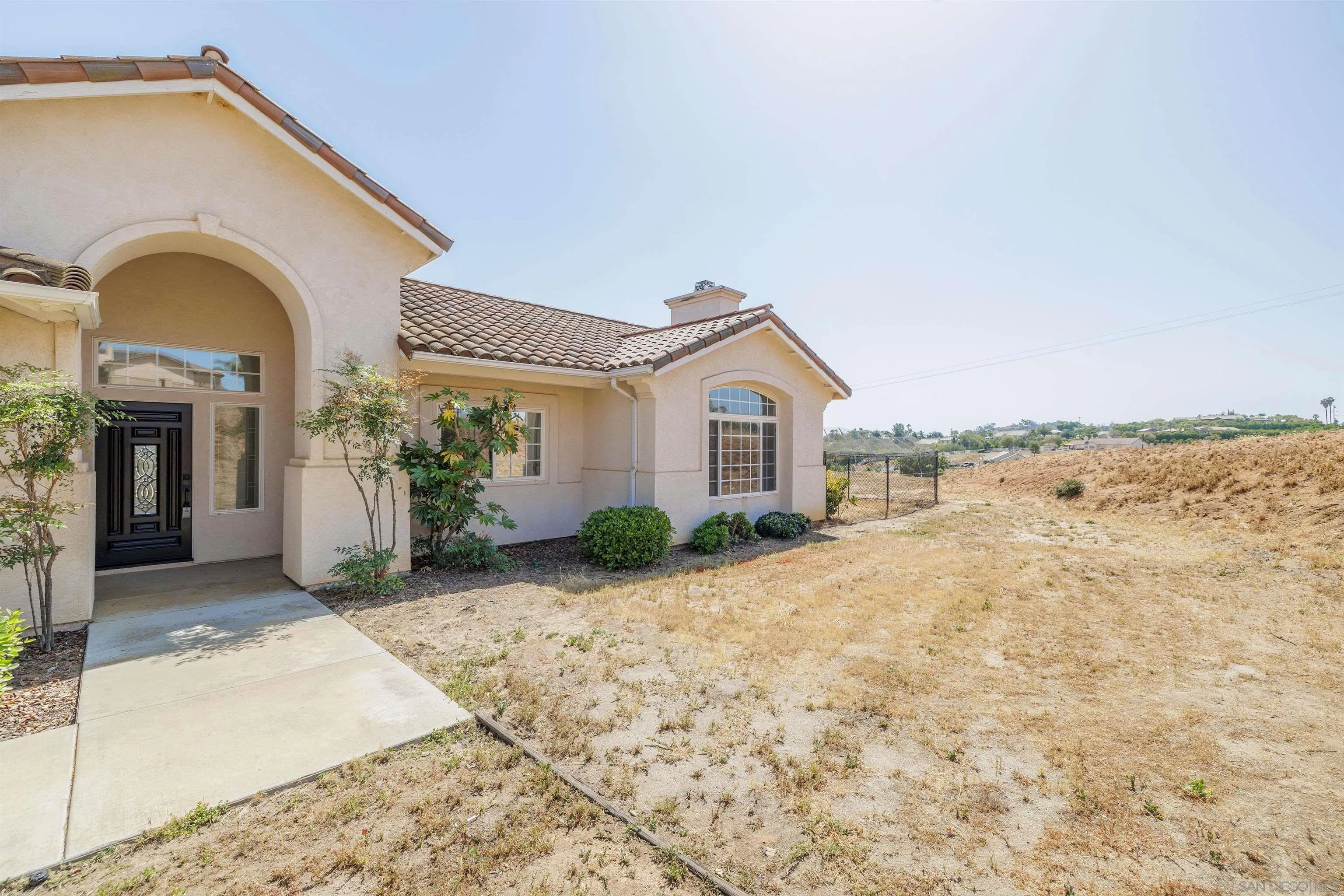 31250 Rivoli Road Valley Center, CA 92082 - Photo 3 of 57 a view of a house with backyard and mountain view