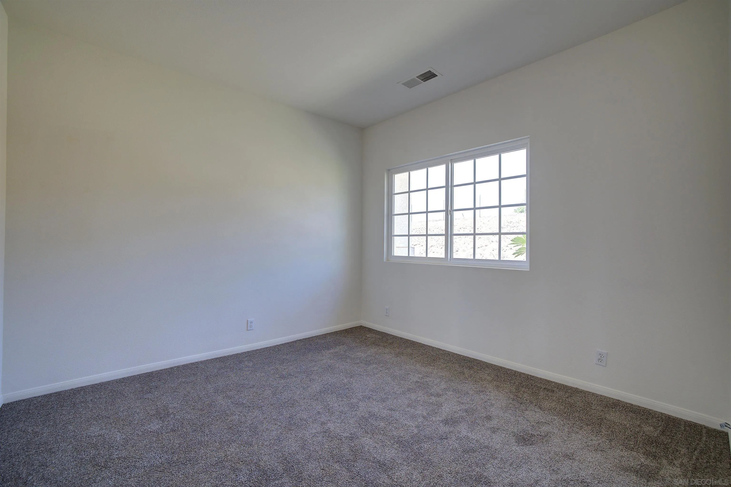 31250 Rivoli Road Valley Center, CA 92082 - Photo 39 of 57 an empty room with a window