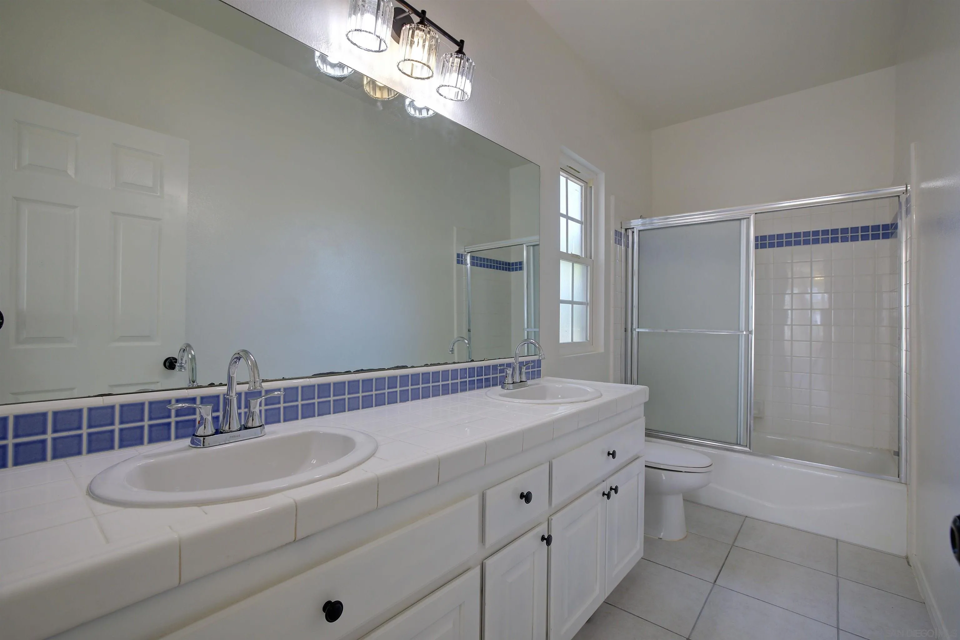 31250 Rivoli Road Valley Center, CA 92082 - Photo 41 of 57 a bathroom with a sink double vanity granite tub and shower