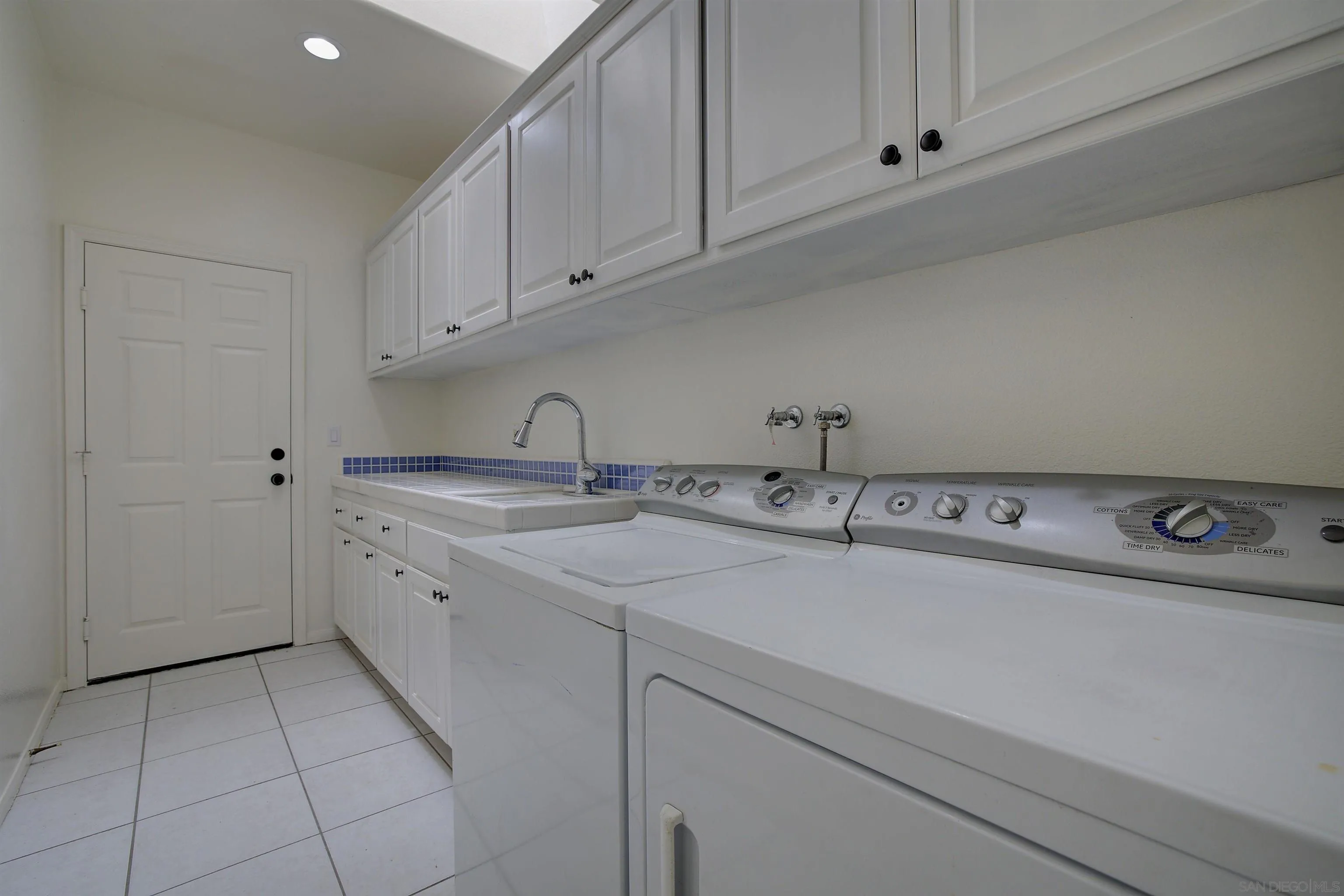 31250 Rivoli Road Valley Center, CA 92082 - Photo 45 of 57 a kitchen with a sink and cabinets