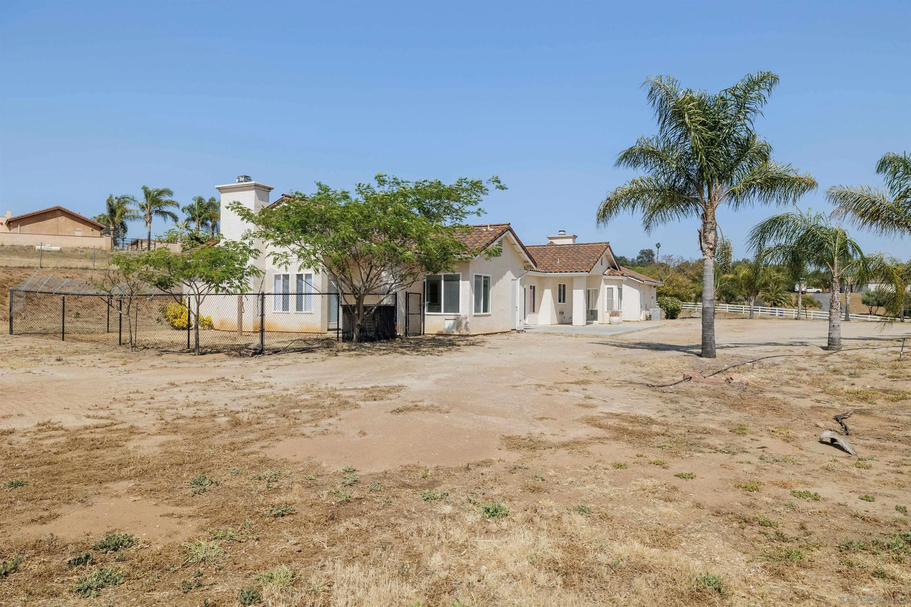 31250 Rivoli Road Valley Center, CA 92082 - Photo 47 of 57 a view of a yard with a house