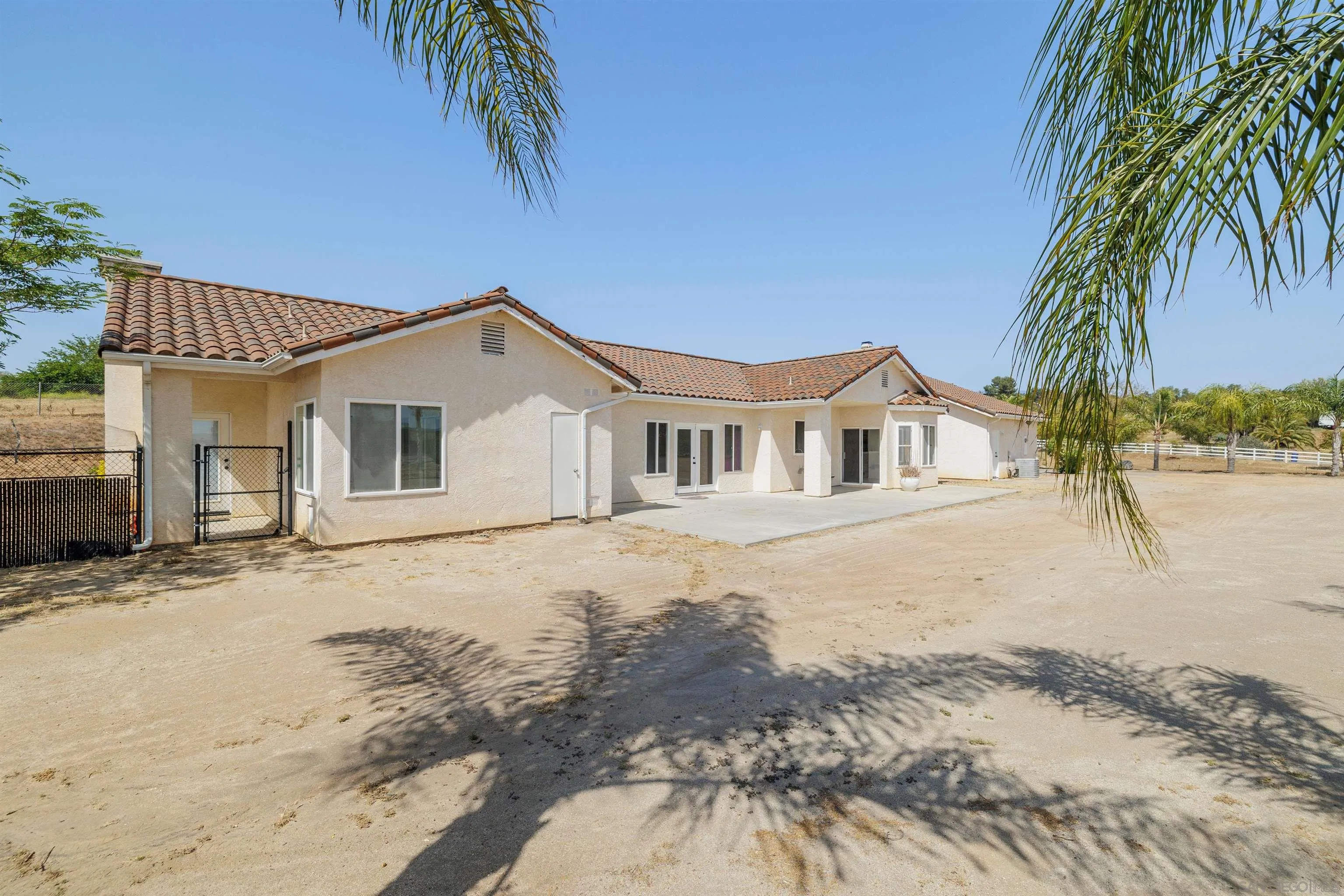 31250 Rivoli Road Valley Center, CA 92082 - Photo 49 of 57 a front view of a house with a yard