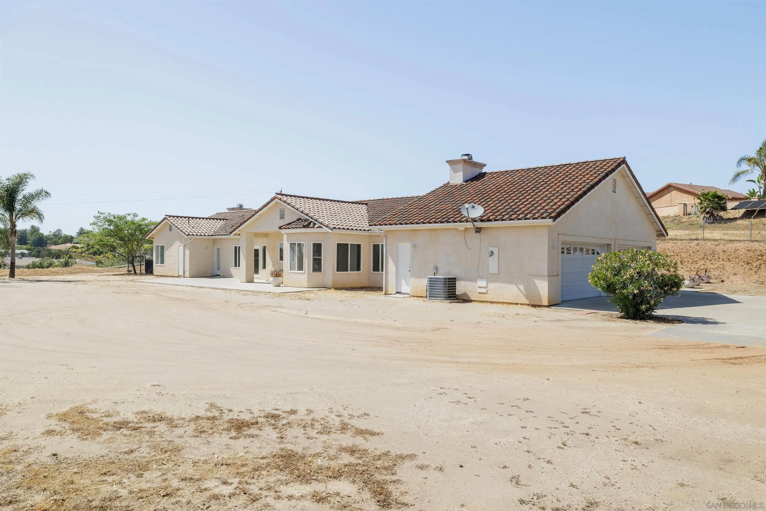 31250 Rivoli Road Valley Center, CA 92082 - Photo 6 of 57 a front view of a house with a yard