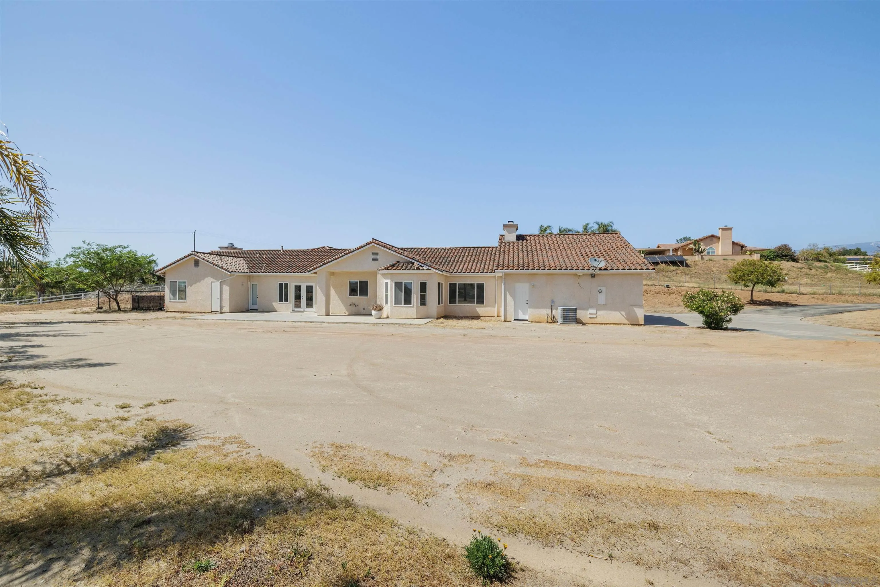 31250 Rivoli Road Valley Center, CA 92082 - Photo 7 of 57 a front view of a house with a yard
