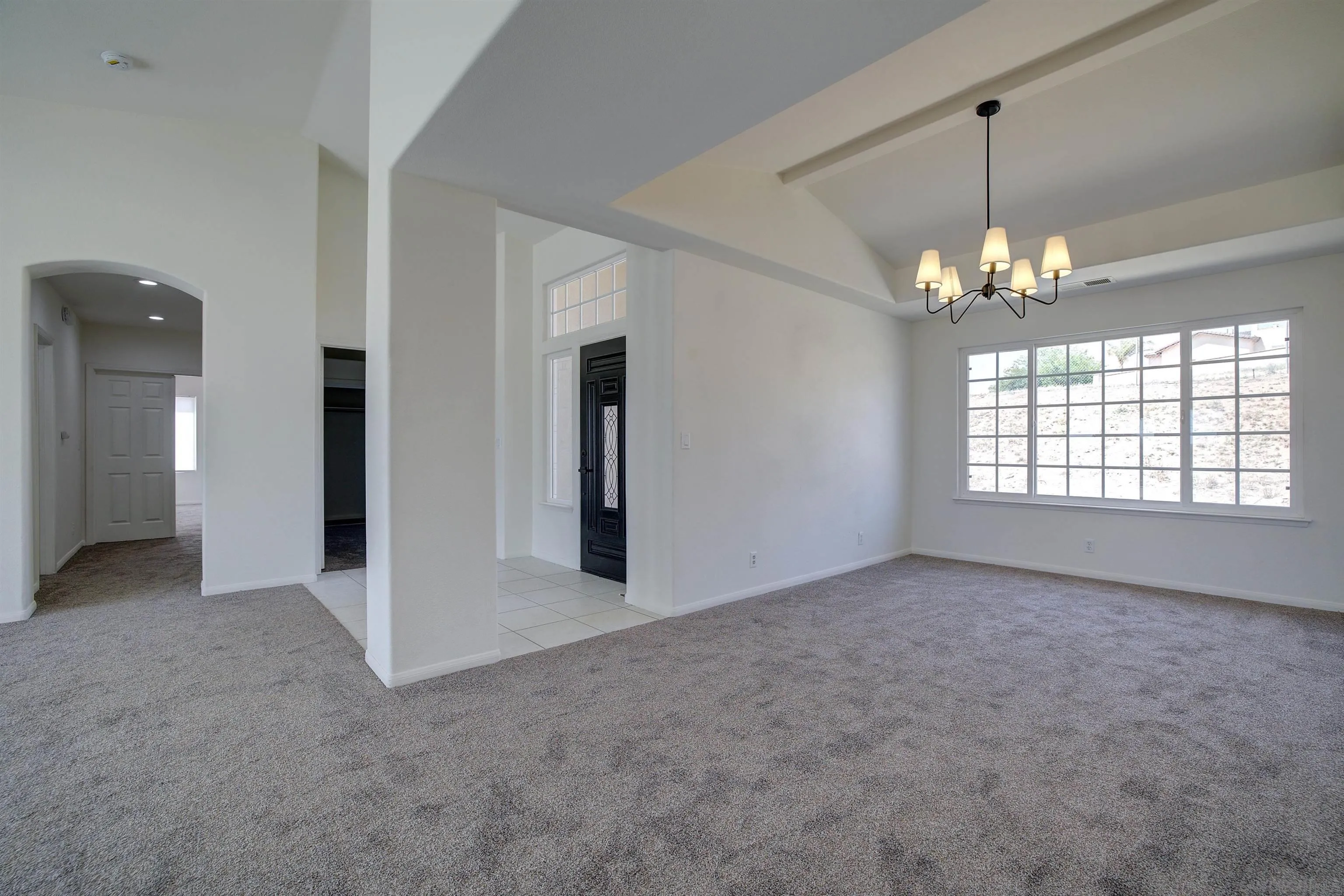 31250 Rivoli Road Valley Center, CA 92082 - Photo 10 of 57 an empty room with windows and entrance