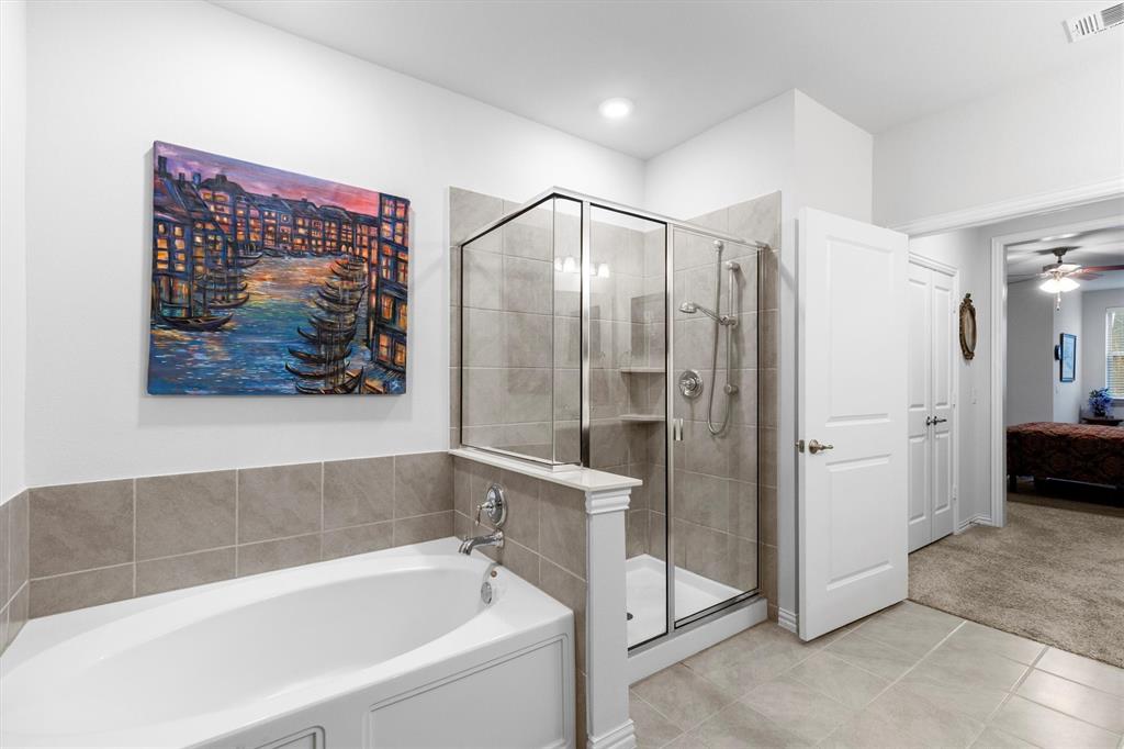 651 Watters Road, Unit 5205 Allen, TX 75013 - Photo 14 of 31 a bathroom with a bathtub and a shower