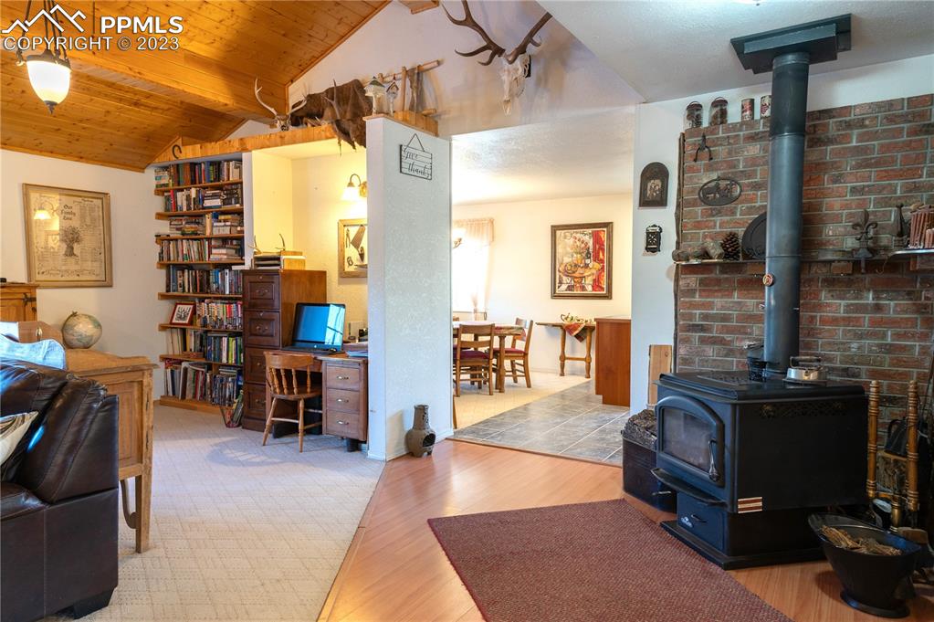 3370 Schieffelin Road Fort Garland, CO 81133 - Photo 11 of 46 a living room with furniture and a flat screen tv