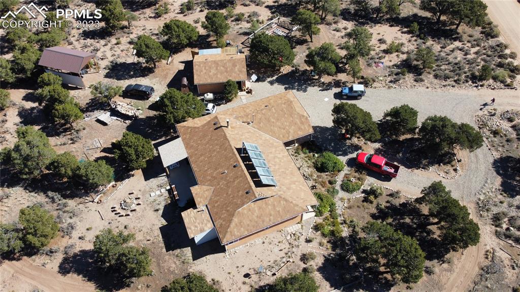 3370 Schieffelin Road Fort Garland, CO 81133 - Photo 2 of 46 an aerial view of a house with a yard and garden