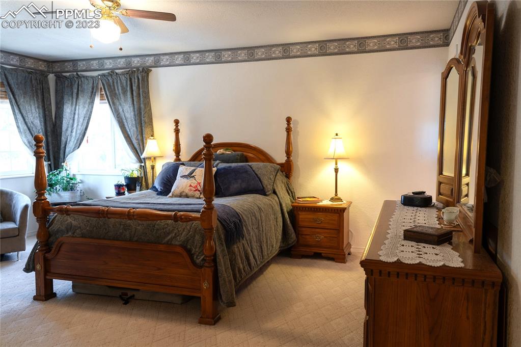 3370 Schieffelin Road Fort Garland, CO 81133 - Photo 21 of 46 a bedroom with a bed and a window