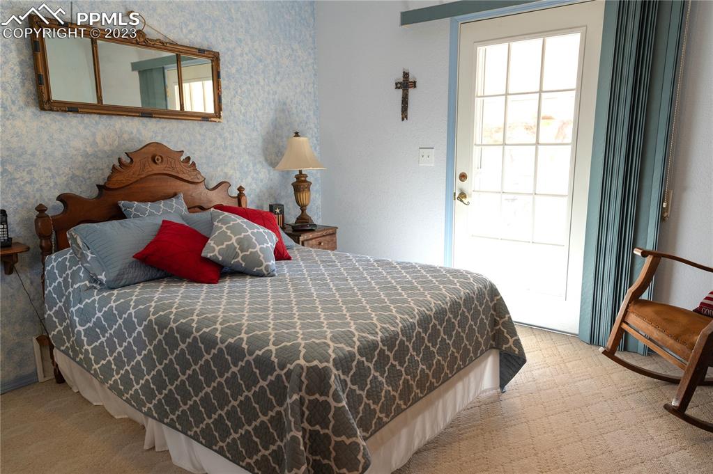 3370 Schieffelin Road Fort Garland, CO 81133 - Photo 30 of 46 a bedroom with a bed and a window