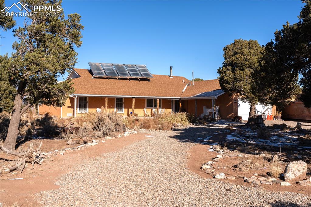 3370 Schieffelin Road Fort Garland, CO 81133 - Photo 3 of 46 a front view of a house with a yard covered in snow