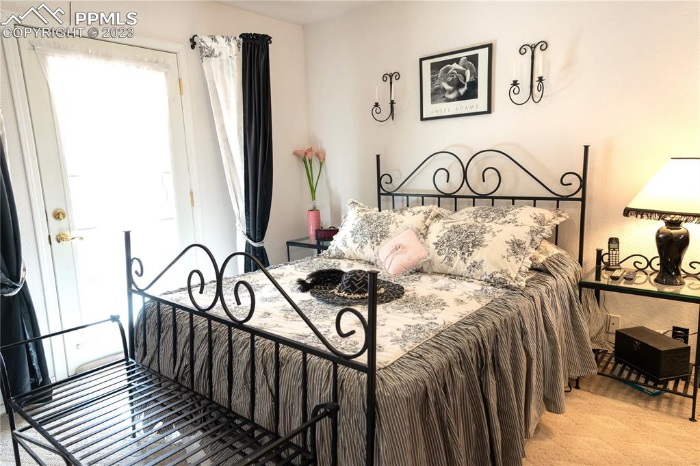 3370 Schieffelin Road Fort Garland, CO 81133 - Photo 34 of 46 a view of a bedroom with bed and furniture