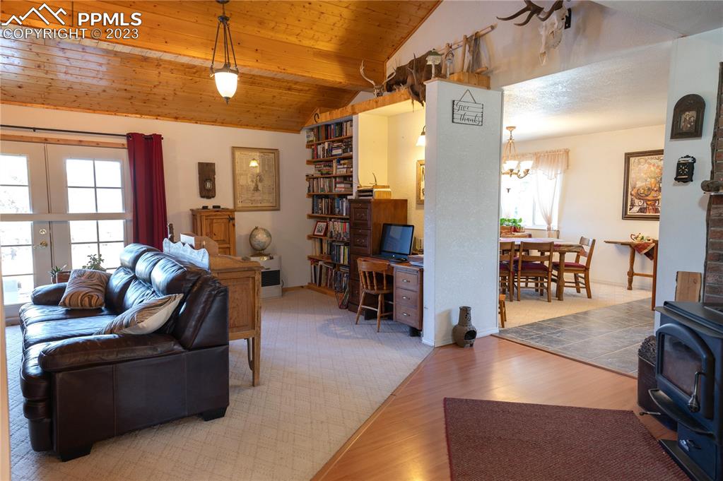 3370 Schieffelin Road Fort Garland, CO 81133 - Photo 10 of 46 a living room with furniture and a flat screen tv