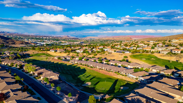 2212 Chippenham Court St. George, UT 84770 - Photo 58 of 75 Aerial perspective of suburban area featuring a mountain backdrop and a golf club