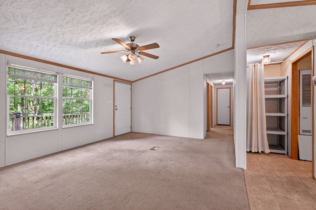 282 West Cherry Road Hayesville, NC 28904 - Photo 9 of 45 a view of empty room with a ceiling fan and window