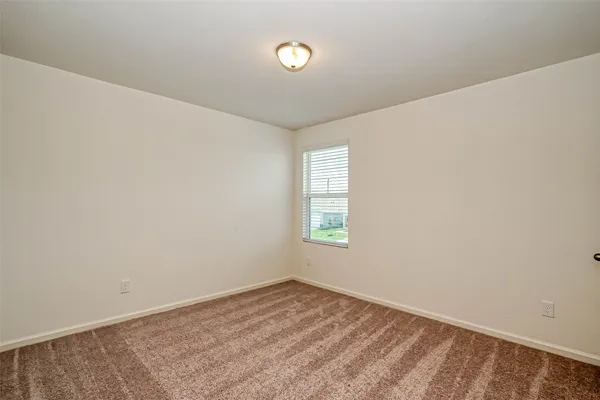 a bathroom with a sink a toilet a mirror and shower