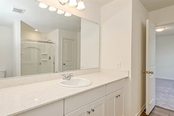 a bathroom with a shower and toilet