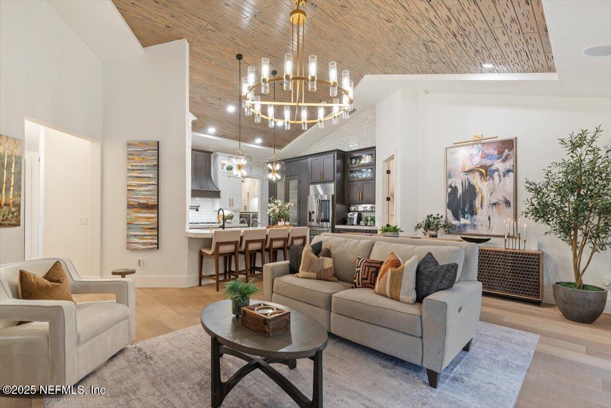 4009 Sioux Circle St. Johns, FL 32259 - Photo 12 of 49 a living room with furniture and a chandelier
