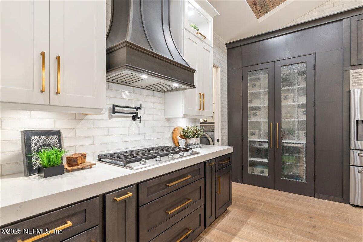 4009 Sioux Circle St. Johns, FL 32259 - Photo 17 of 49 a kitchen with stainless steel appliances granite countertop a sink a stove and a wooden floors