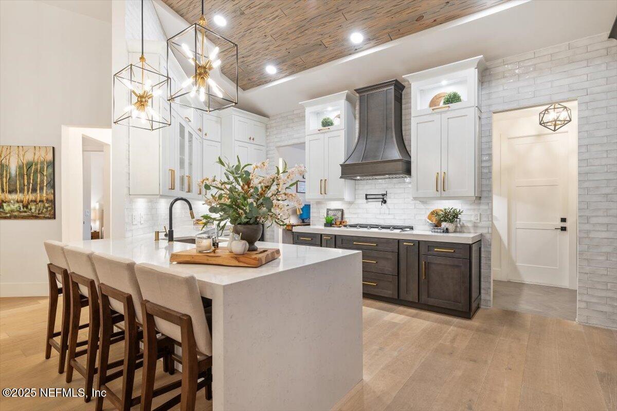 4009 Sioux Circle St. Johns, FL 32259 - Photo 19 of 49 a kitchen with stainless steel appliances kitchen island granite countertop a sink and cabinets