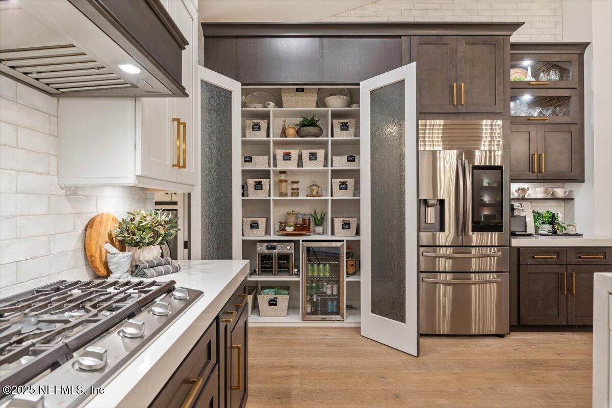 4009 Sioux Circle St. Johns, FL 32259 - Photo 23 of 49 a kitchen with stainless steel appliances granite countertop a stove and a refrigerator