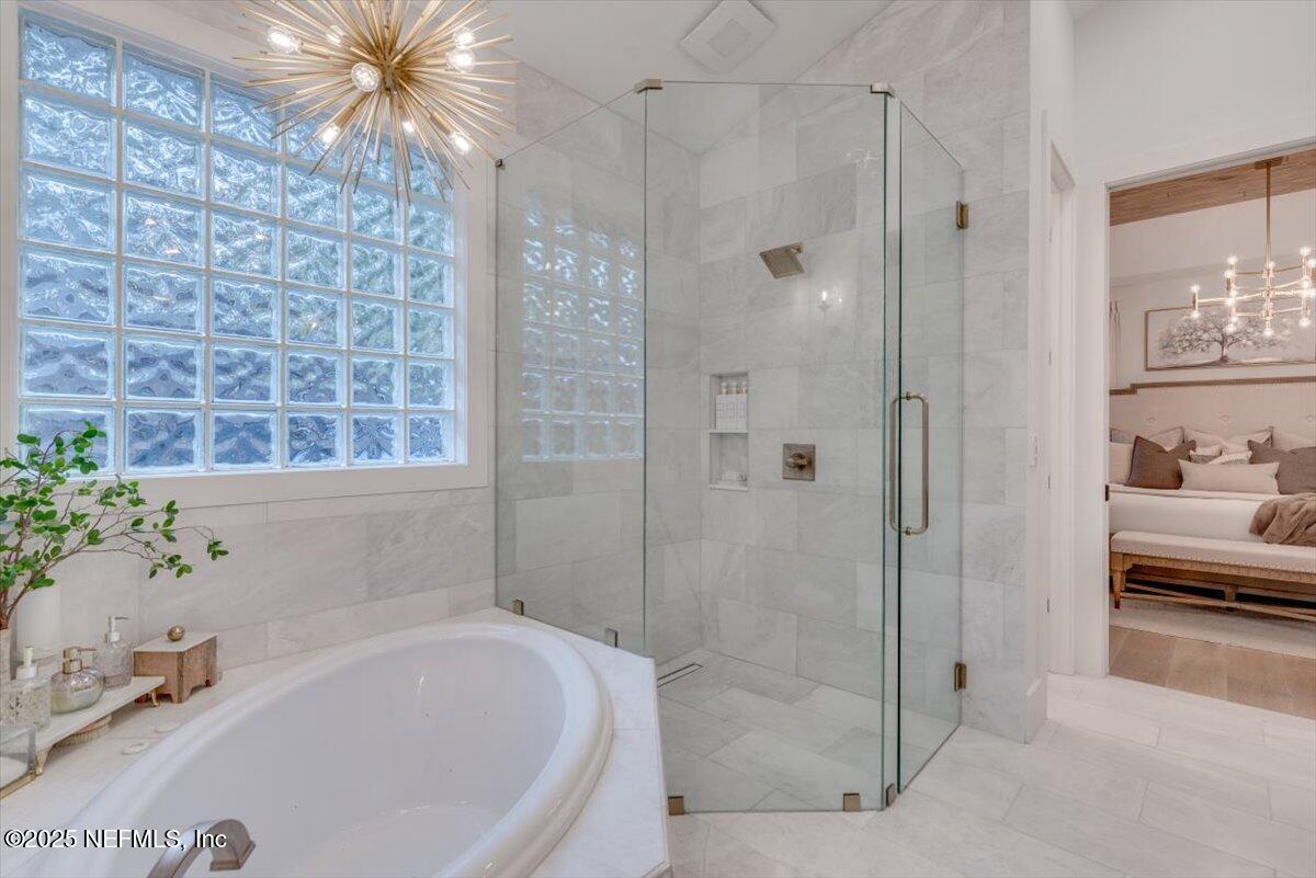 4009 Sioux Circle St. Johns, FL 32259 - Photo 31 of 49 a bathroom with a bathtub and a shower