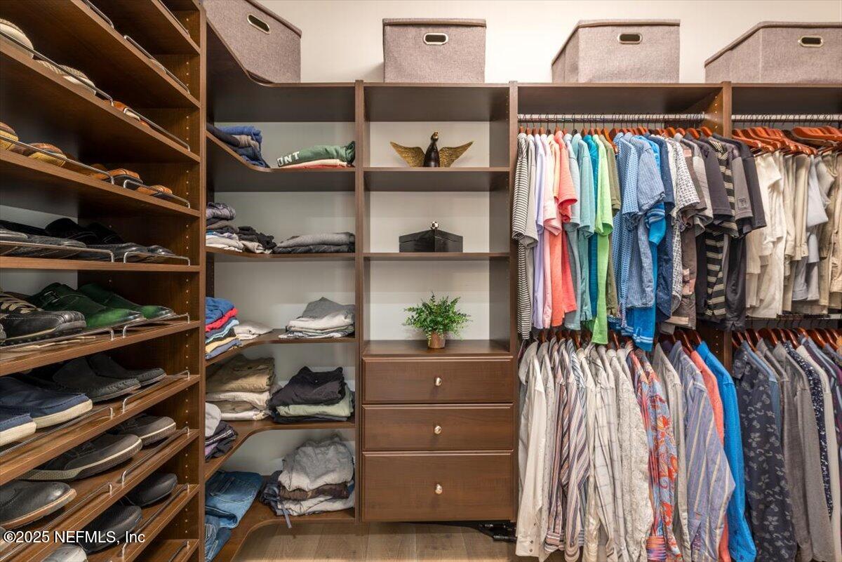4009 Sioux Circle St. Johns, FL 32259 - Photo 33 of 49 a view of walk in closet with clothes and shoes