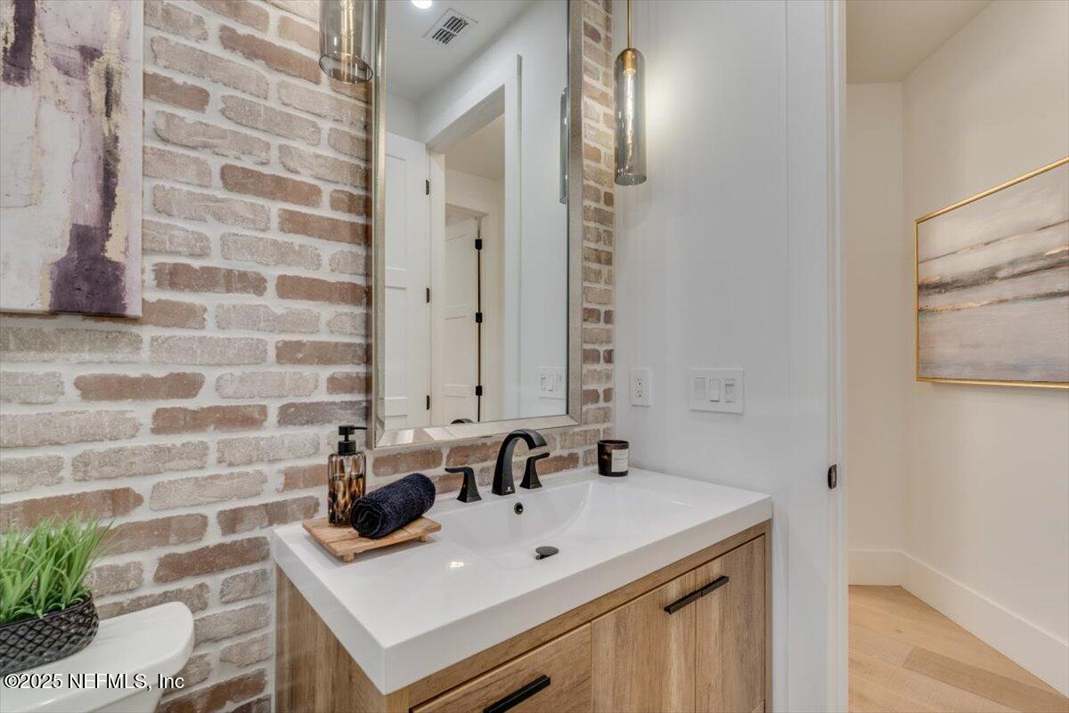4009 Sioux Circle St. Johns, FL 32259 - Photo 38 of 49 a bathroom with a sink and a mirror