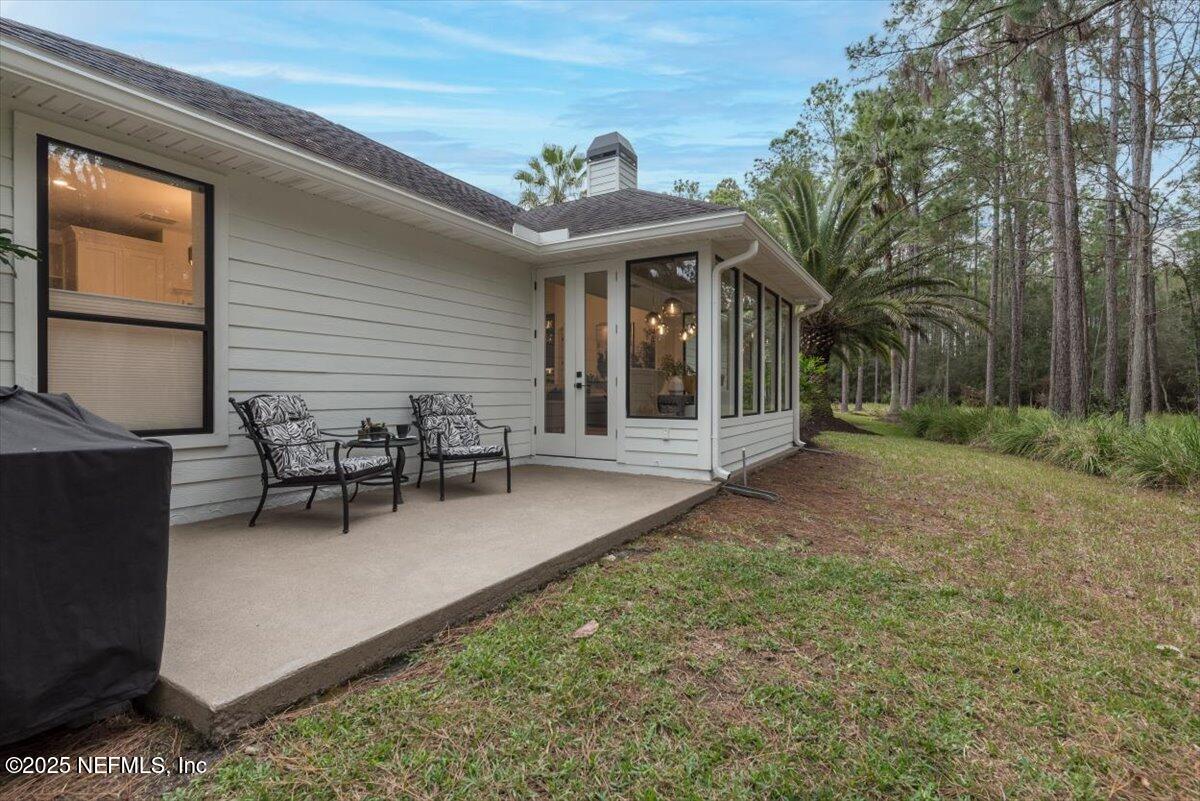 4009 Sioux Circle St. Johns, FL 32259 - Photo 42 of 49 a view of a house with backyard porch and sitting area