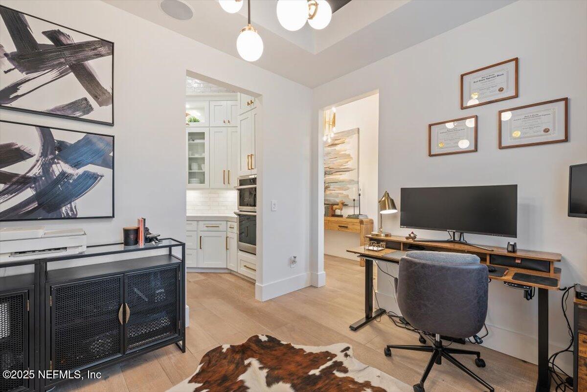 4009 Sioux Circle St. Johns, FL 32259 - Photo 8 of 49 a view of a workspace with furniture and a fireplace