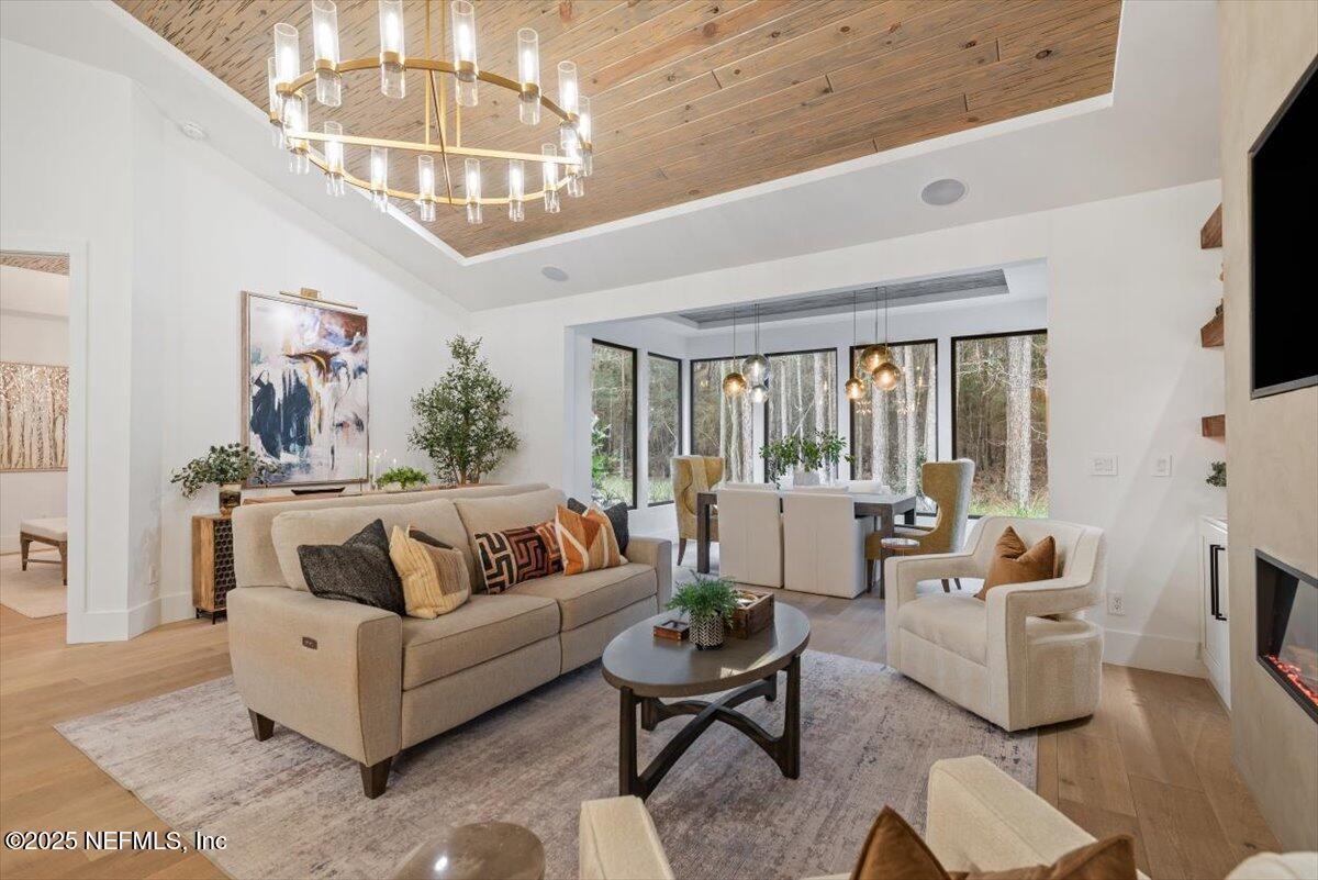 4009 Sioux Circle St. Johns, FL 32259 - Photo 9 of 49 a living room with furniture and a chandelier