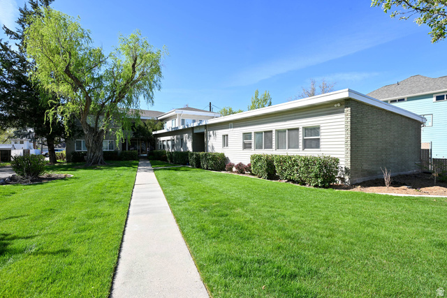 550 100 North Provo, UT 84606 - Photo 4 of 7 Expansive lawn with a concrete pathway leading to the main entrance