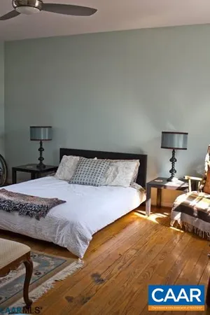 a bedroom with bed and window