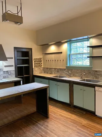 a kitchen with stainless steel appliances granite countertop a sink and a stove