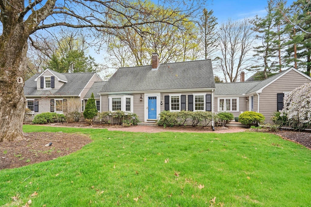 a front view of a house with a garden and porch