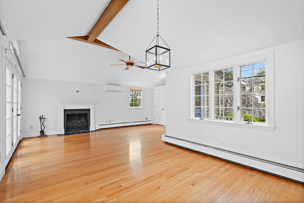 2270 Massachusetts Avenue Lexington, MA 02421 - Photo 12 of 33 a view of an empty room with wooden floor and a window