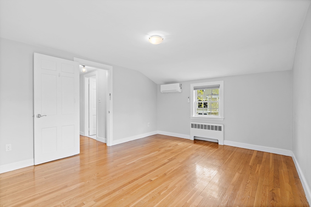 2270 Massachusetts Avenue Lexington, MA 02421 - Photo 23 of 33 a view of empty room with wooden floor and fan