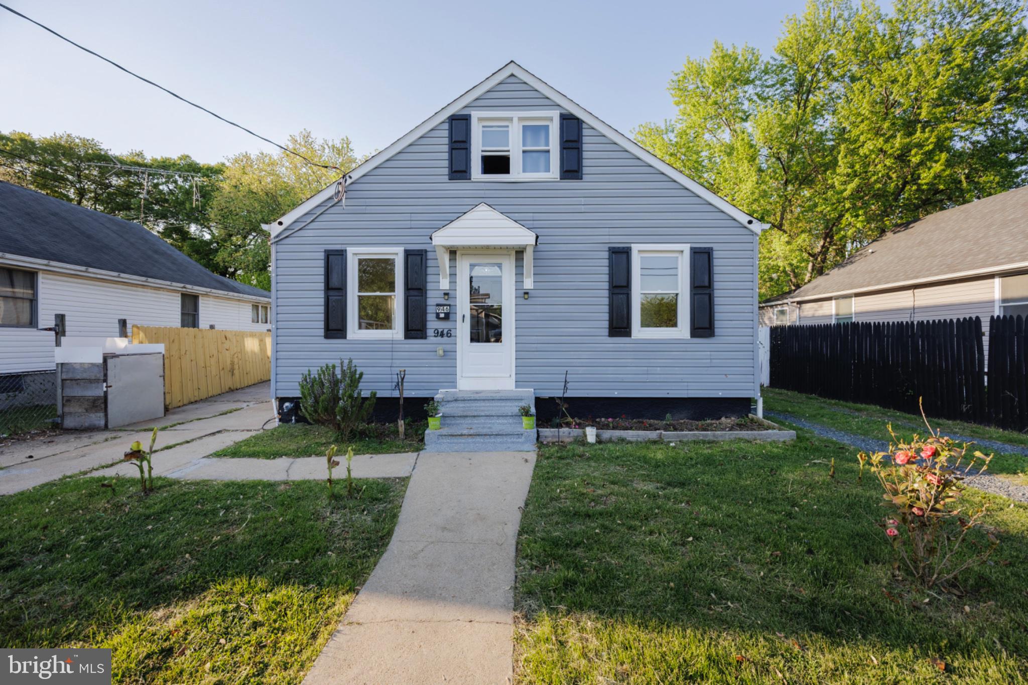 946 Martin Road Essex, MD 21221 - Photo 2 of 48 Charming blue home with lush greenery.