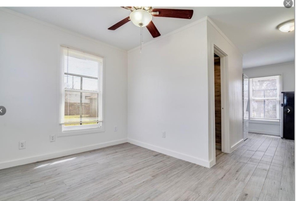 2511 East 2nd Street, Unit B Austin, TX 78702 - Photo 11 of 11 wooden floor in an empty room with a window