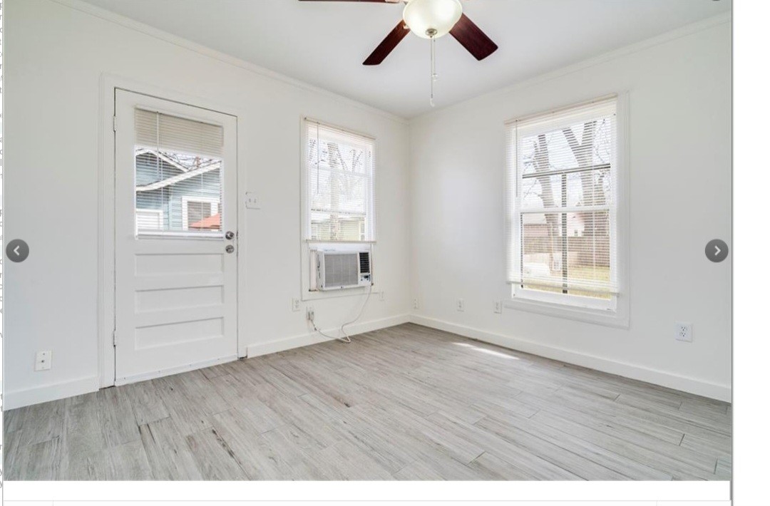 2511 East 2nd Street, Unit B Austin, TX 78702 - Photo 10 of 11 wooden floor in an empty room with a window