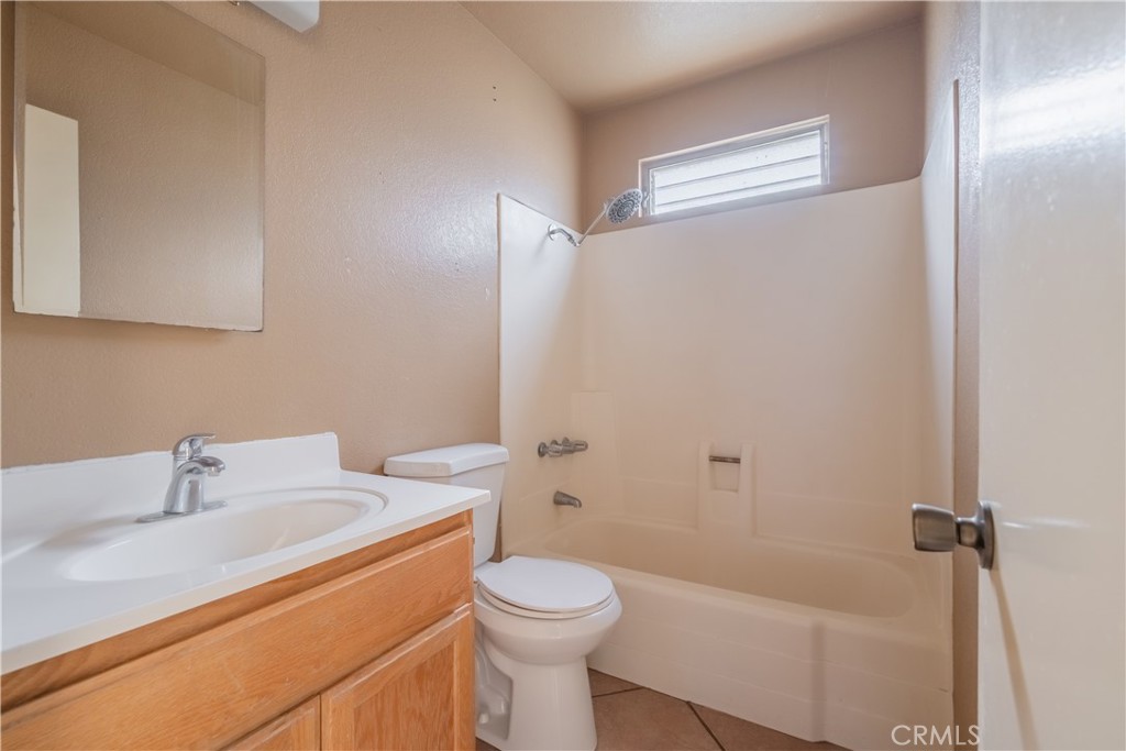 6084 Vanessa Street Riverside, CA 92504 - Photo 19 of 35 a bathroom with a sink a toilet and shower