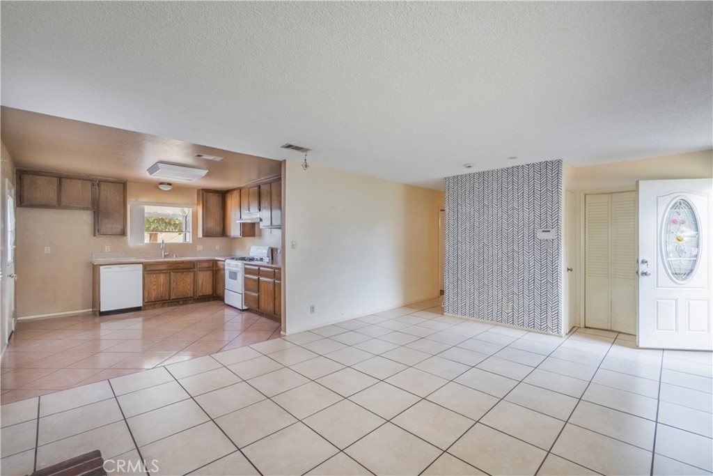 6084 Vanessa Street Riverside, CA 92504 - Photo 28 of 35 a view of a kitchen with a sink and a stove top oven